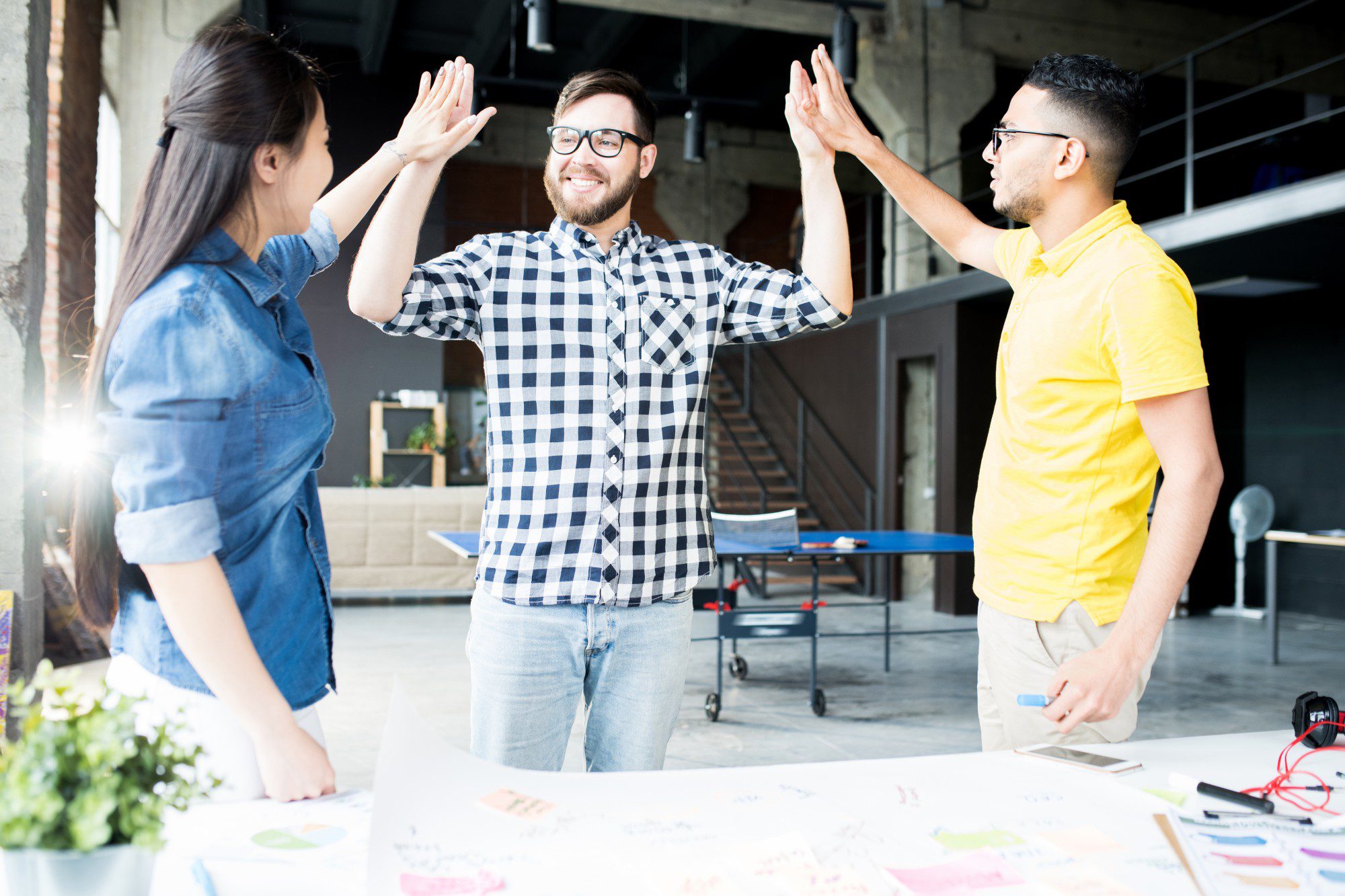Creative Business Team High Five in Office