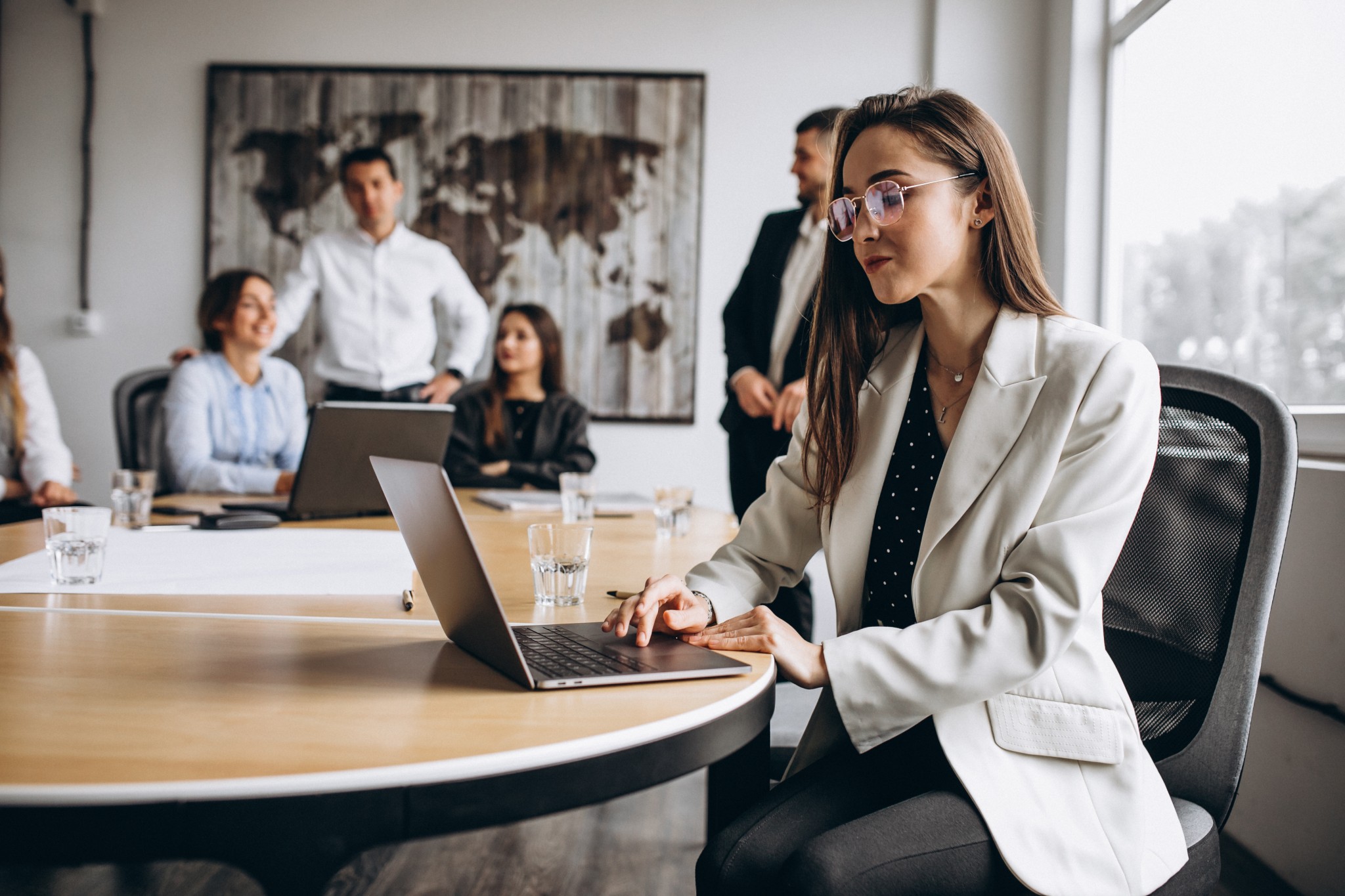 Group of people working out business plan in an office Group of people working out business plan in an office