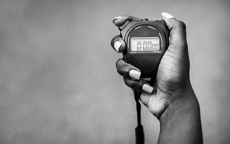 Hand holding a stopwatch
