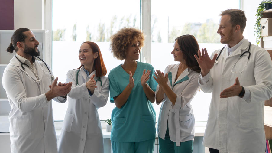 Medical professionals clapping hands
